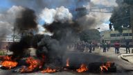 Protesters set a barricade on fire in Valencia, Venezuela&#39;s third-biggest city