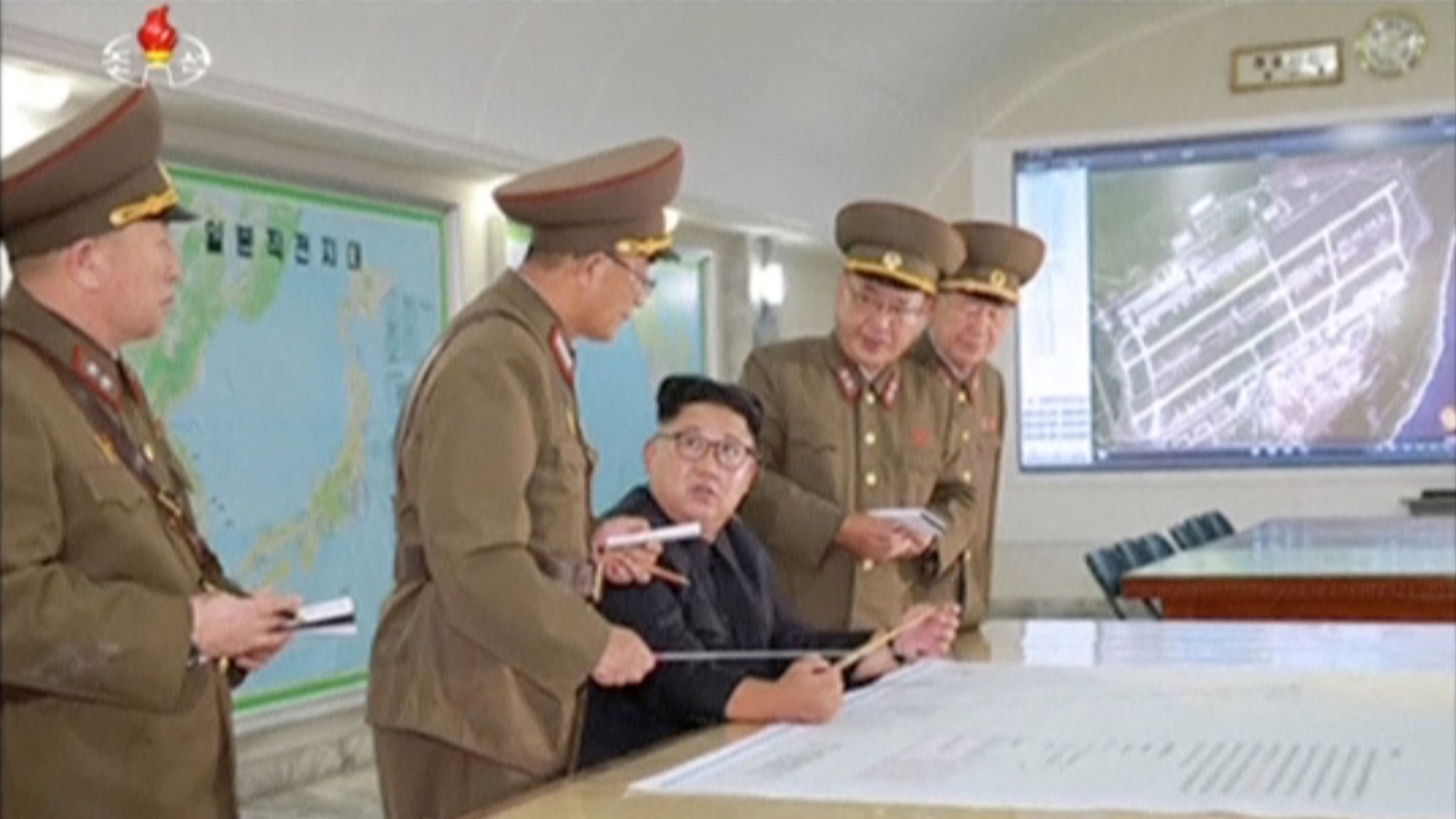 North Korea's Kim Jong Un shown plans to strike Guam with missiles ...