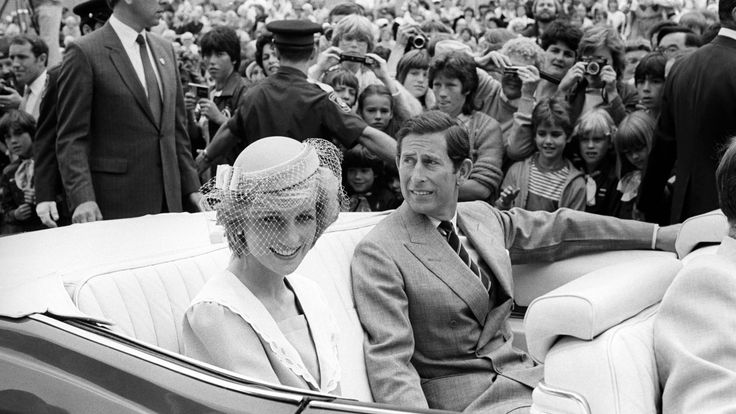 The Prince and Princess of Wales sit in an open car, about to be driven off after their walkabout in Charlottetown, Prince Edward Island