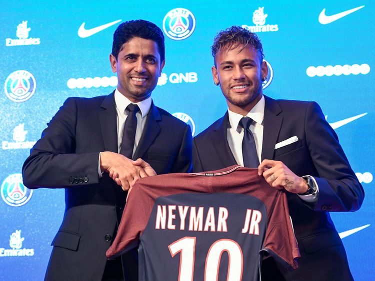 Neymar (R) and PSG president Nasser Al-Khelaifi after he completed his move to the club from Barcelona