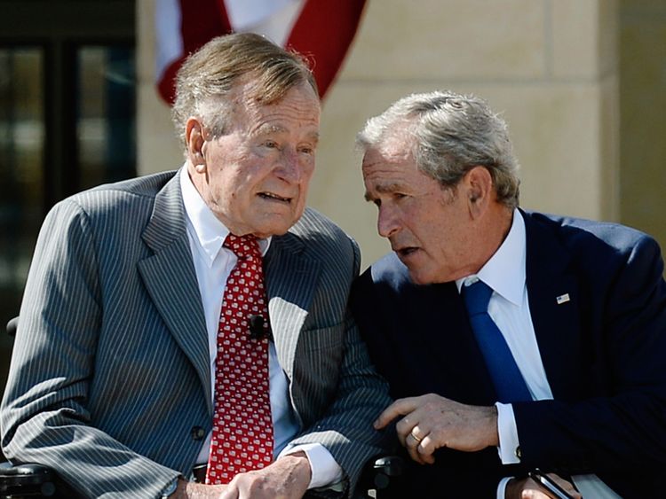 The father and son presidents pictured together in 2013