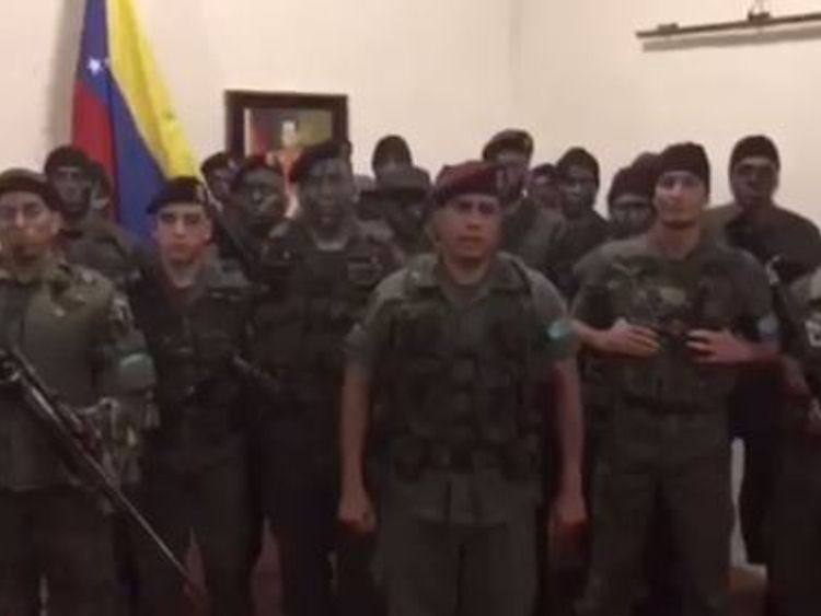 The video posted on Twitter shows a man in army captain uniform surrounded by 16 men in camouflage