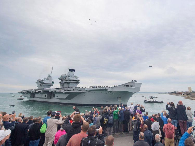 Dozens of spectators lined Portsmouth Harbour to witness HMS Queen Elizabeth&#39;s arrival