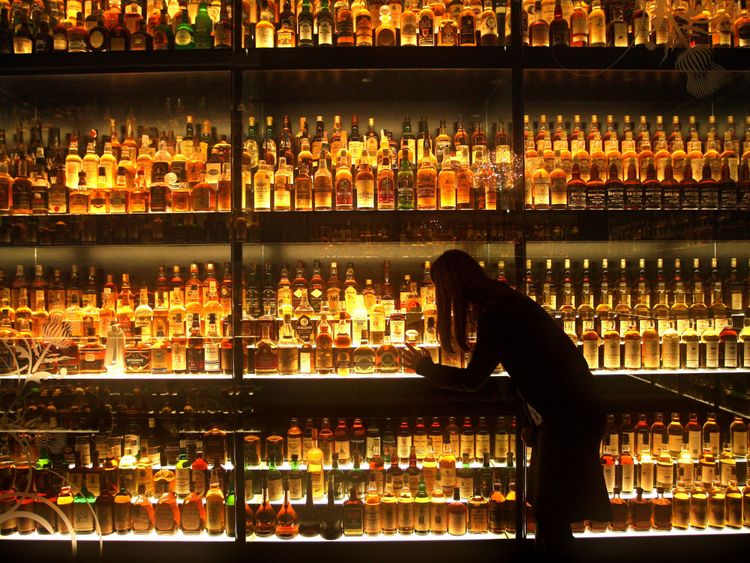 A member of staff looking at the Diageo Claive Scotch Whisky collection A member of staff looking at the Diageo Claive Scotch Whisky collection