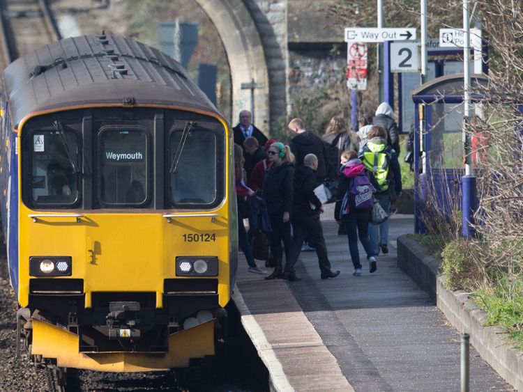 BATH, ENGLAND - FEBRUARY 19: A Weymouth bound train stops at Oldfield Park station as it approaches Bath Spa station on the Great Western railway line on February 19, 2016 in Bath, England. 