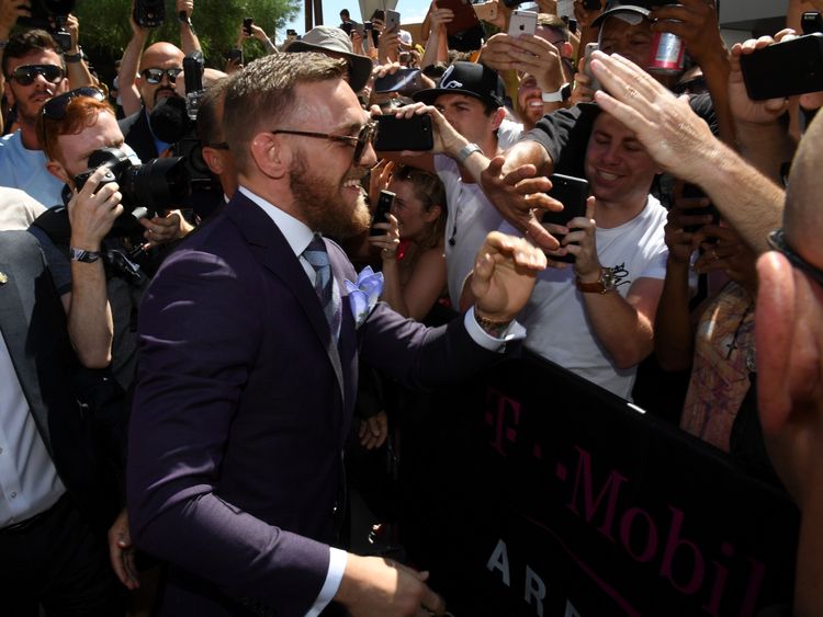 LAS VEGAS, NV - AUGUST 22:  UFC lightweight champion Conor McGregor greets fans as he arrives at Toshiba Plaza on August 22, 2017 in Las Vegas, Nevada. McG