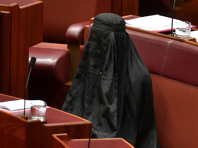 Australian One Nation party leader, Senator Pauline Hanson wears a burqa in the Senate chamber 