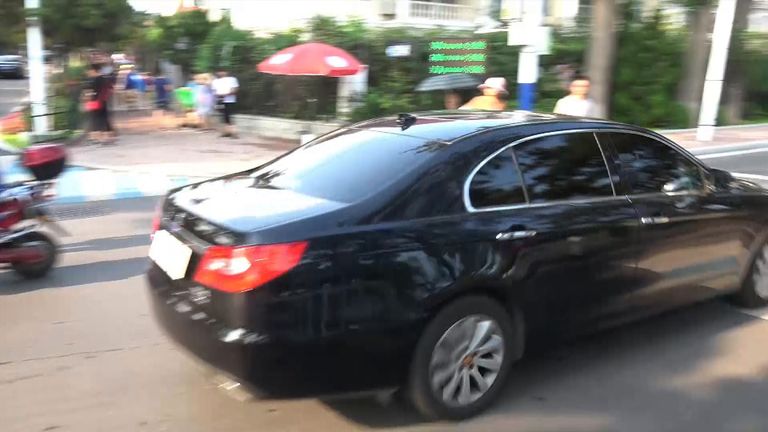 Black cars sweep through at speed