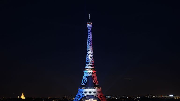 The Eiffel Tower is lit up in the colours of the French flag on Bastille Day