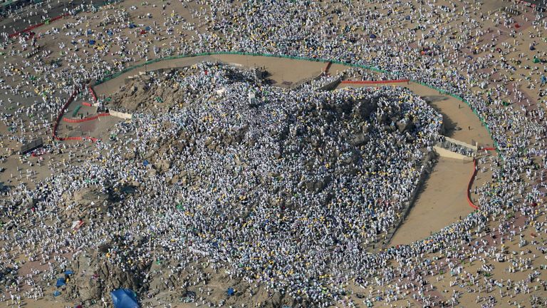 Muslim pilgrims gathering on Mount Arafat