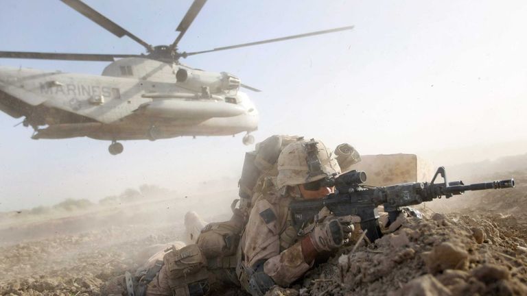 A U.S. Marine from 2nd Marine Expeditionary Brigade, RCT 2nd Battalion 8th Marines Echo Co. during the start of Operation Khanjari on July 2, 2009 in Main Poshteh, Afghanistan