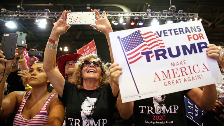 Donald Trump supporters cheer him at a campaign rally in Phoenix