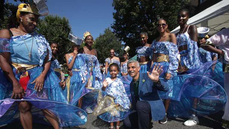 Mayor of London Sadiq Khan with performers during the Notting Hill Carnival Family Day