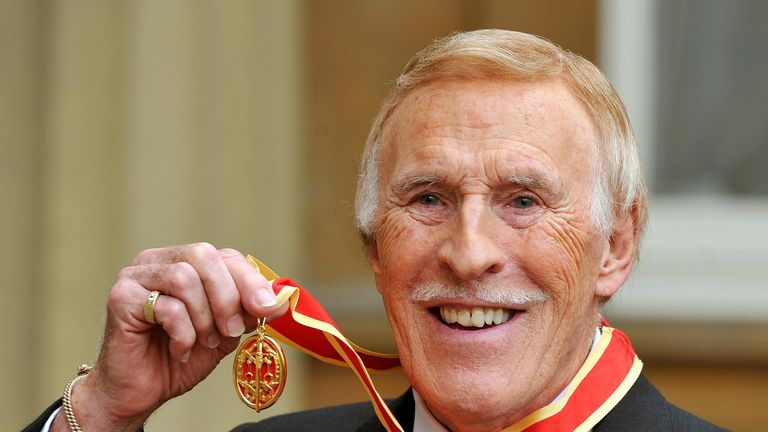 Sir Bruce after he was knighted by the Queen in 2011
