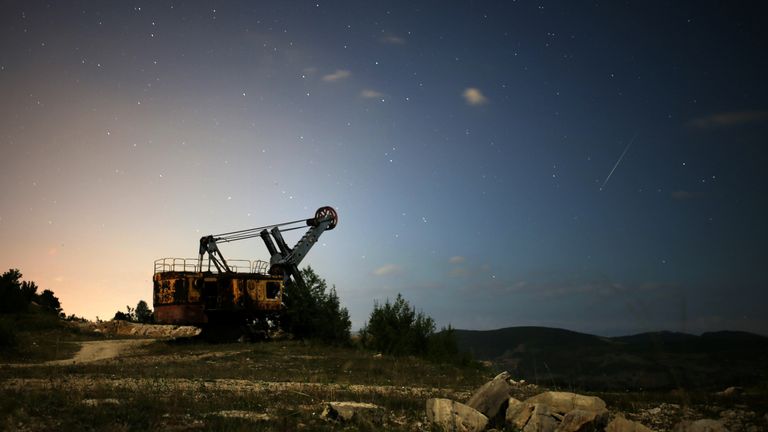 A meteor streaks over an abandoned coal mine in Bosnia and Herzegovina