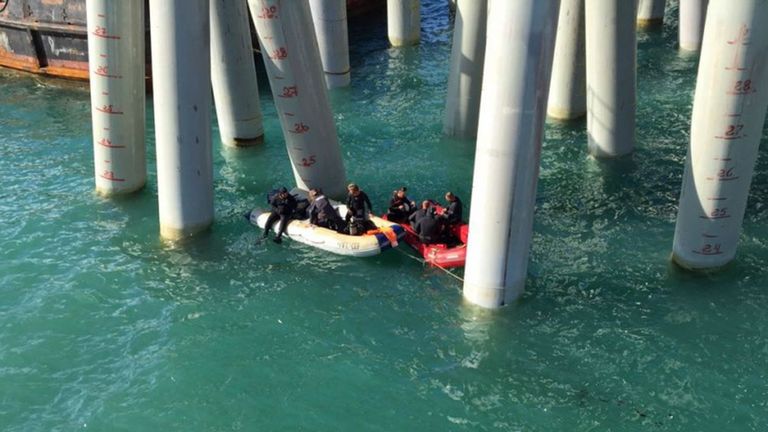 Divers helped find survivors after the bus fell four metres into the sea