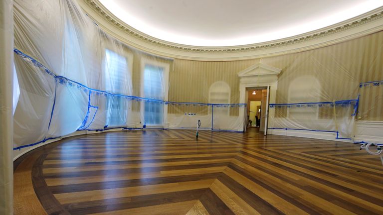 A bare Oval Office reveals hypnotic wooden flooring
