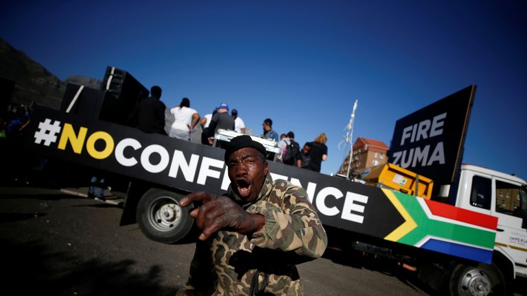 Anti-Zuma protesters march ahead of the vote of no confidence against President Jacob Zuma
