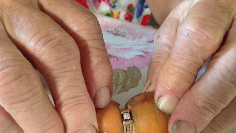 An 84-year-old found her lost engagement ring - which had been missing for 13 years - with a carrot growing through it Credit: Sarah Kraus, Global News