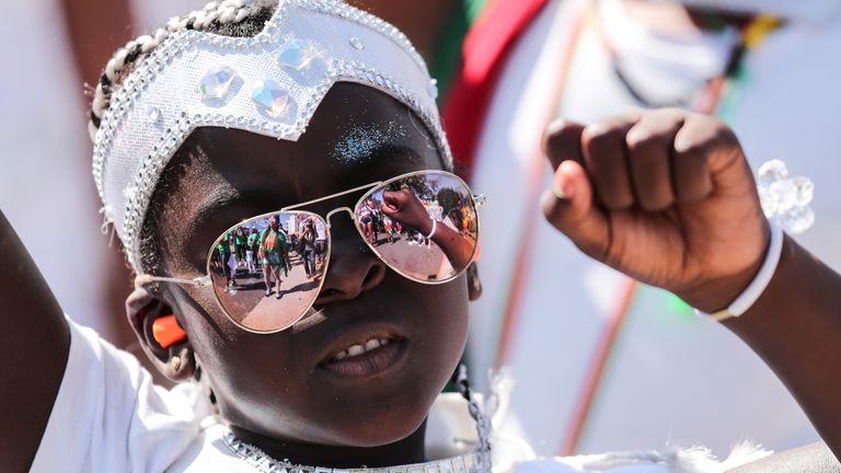 A young reveller takes part in the children&#39;s parade during the Notting Hill Carnival in London