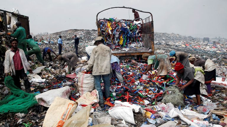 Scavengers sort recyclable plastic materials at the Dandora dumping site on the outskirts of Nairobi, Kenya August 25, 2017. Picture taken August 25, 2017. REUTERS/Thomas Mukoya
