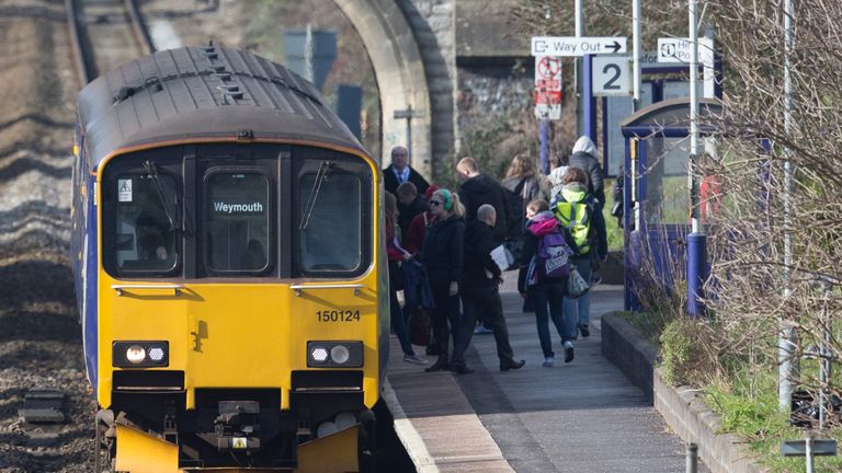 BATH, ENGLAND - FEBRUARY 19: A Weymouth bound train stops at Oldfield Park station as it approaches Bath Spa station on the Great Western railway line on February 19, 2016 in Bath, England. 