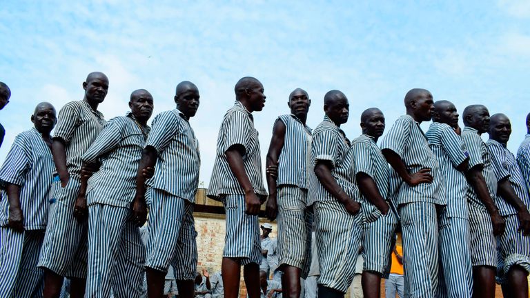 Inmates wait to cast their vote in a maximum security prison in Kisumu on Lake Victoria