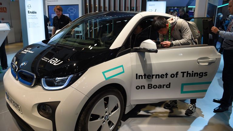 Visitors test a car with internet connection during the Mobile World Congress in Barcelona, 2016