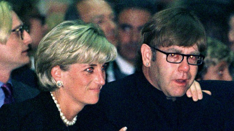 July 1997: Diana comforts pop star Elton John as he weeps at a memorial mass for Italian Fashion King Gianni Versace in Milan 