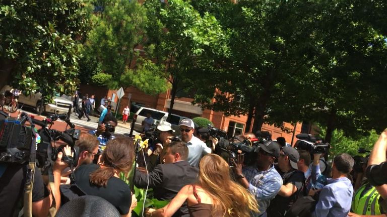 Jason Kessler is dived upon by a protester in Charlottesville