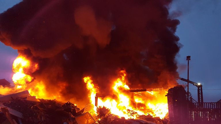 Photographs from the scene show intense flames at the site. Pic: @Blackburn_fire