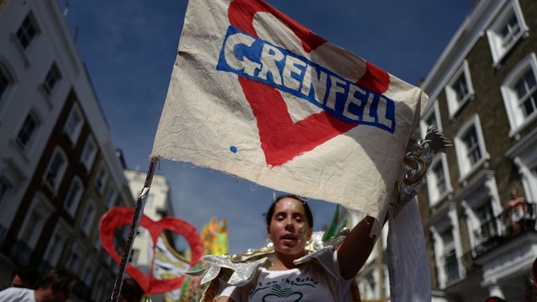 Many held flags to remember those lost in the Grenfell blaze