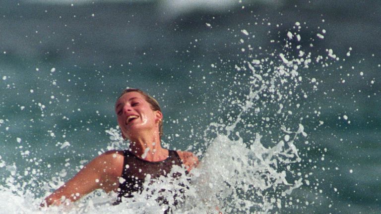 Jan 1993: Diana enjoys the splash of a wave during a morning swim on the Caribbean Island of Nevis