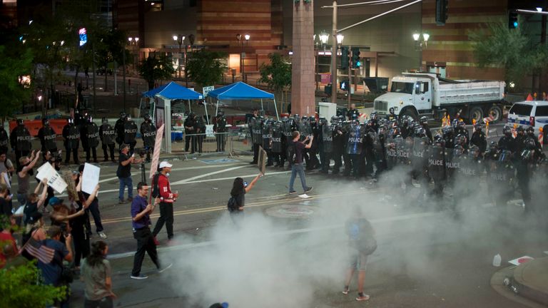 Police use tear gas to break up protesters 