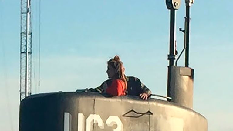 This photo shows allegedly Swedish journalist Kim Wall standing in the tower of the private submarine &#39;UC3 Nautilus&#39; on August 10, 2017 in Copenhagen Harbor