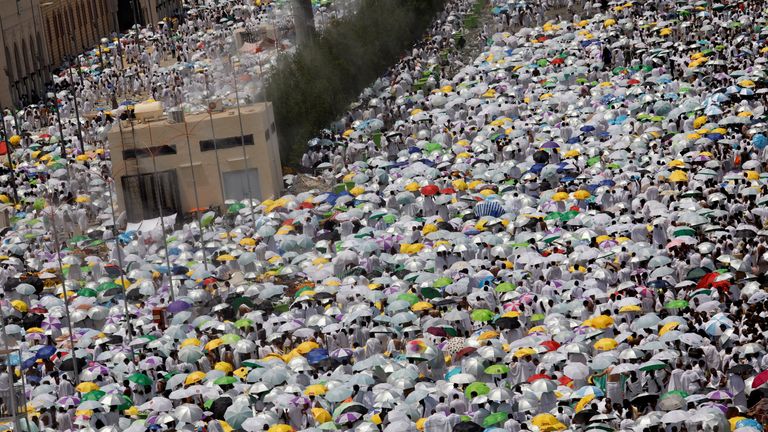 Muslim pilgrims pray outside Namira Mosque on the plains of Arafat during the annual haj pilgrimage