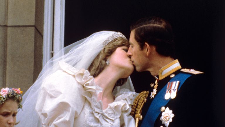 July 1981: The newly married Prince and Princess of Wales kiss on the balcony of Buckingham Palace after their wedding ceremony at St. Paul&#39;s cathedral