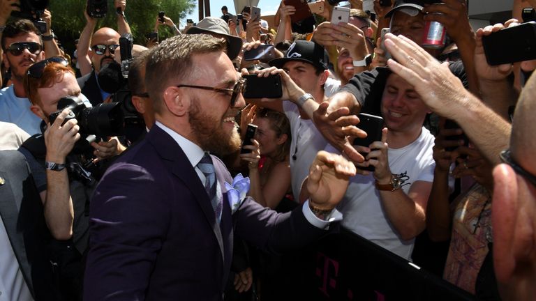 LAS VEGAS, NV - AUGUST 22:  UFC lightweight champion Conor McGregor greets fans as he arrives at Toshiba Plaza on August 22, 2017 in Las Vegas, Nevada. McG