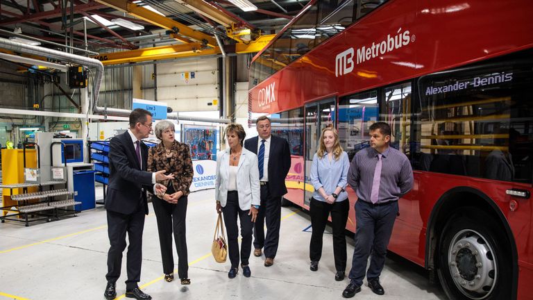 Theresa May tours the Alexander Dennis bus and coach manufacturers factory in Guildford