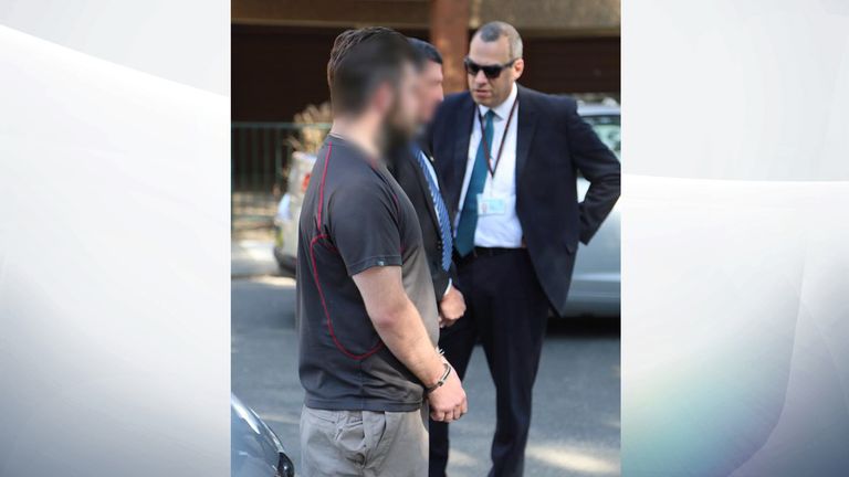 Police stand with the British man after he is arrested in Sydney. Pic: NSW Police