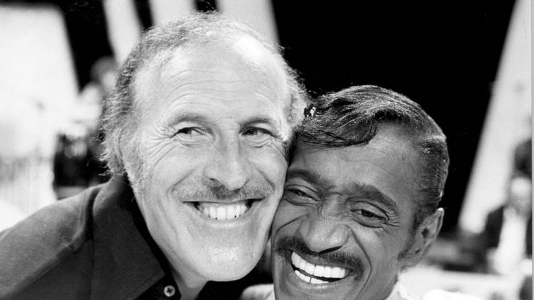 The entertainer with singer and dancer Sammy Davis Jnr in 1980