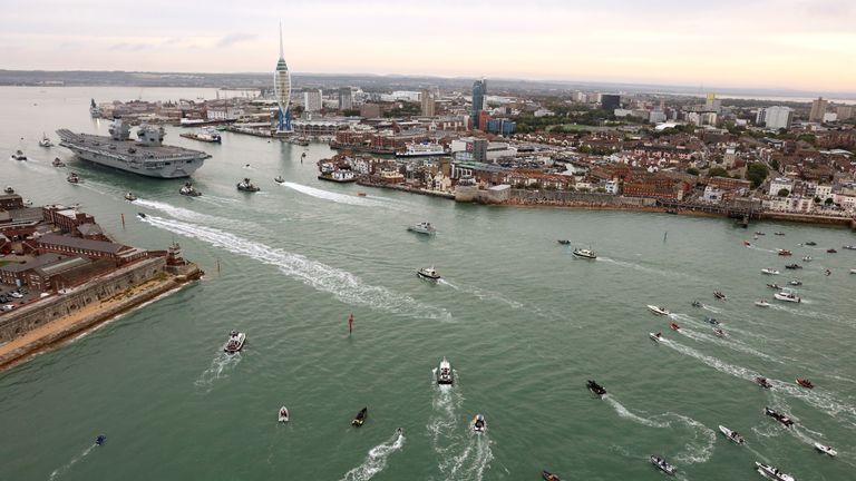 A flotilla of small boars surrounded the ship as it entered the harbour. Pic: MoD