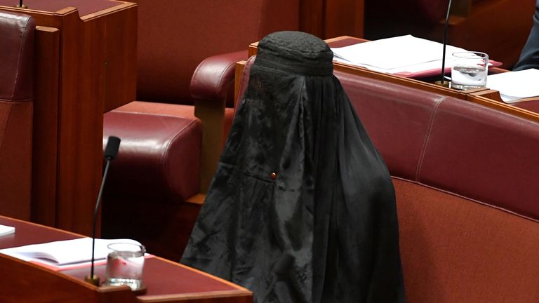 Australian One Nation party leader, Senator Pauline Hanson wears a burqa in the Senate chamber 