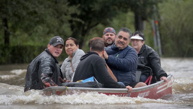People are rescued from a flooded area of Houston after Hurricane Harvey