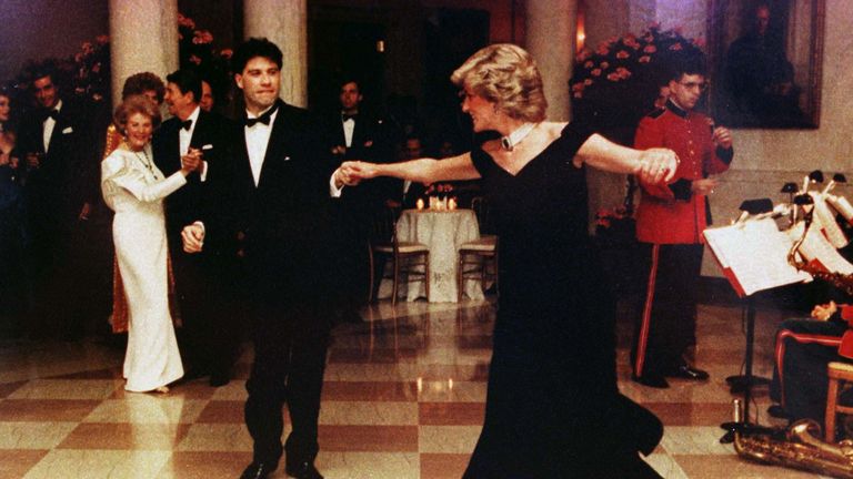 Nov 1985: Diana wears a Victor Edelstein gown as she dances at a White House dinner with John Travolta. The gown sold for $222,500 during an AIDS charity auction