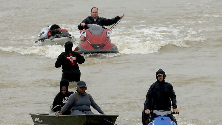 Residents are rescued using jet skis in Houston
