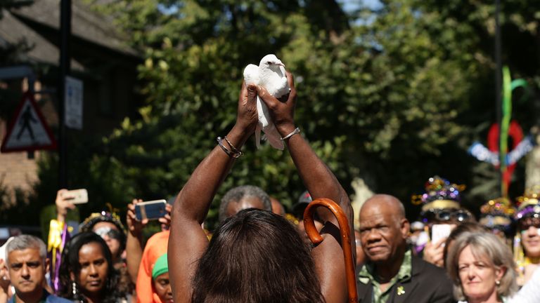 Doves are released as a show of respect for those who died in the Grenfell Tower fire