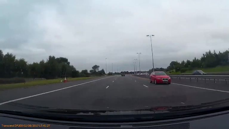 The red Audi travelled the wrong way down the motorway before crashing. Pic: @PhilGill1982