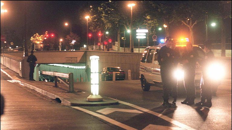 Police guard an entrance of the Alma tunnel in Paris early 31 August
