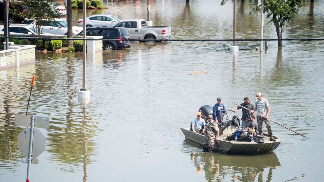 Rescue crews help Harvey flood victims